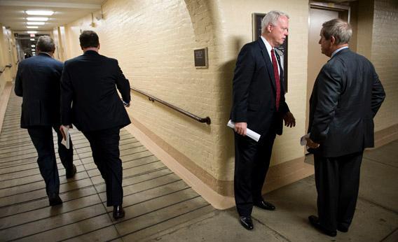 Rep. Paul Broun, R-Ga., and Rep. Joe Wilson, R-S.C., talk as they leave the House Republican Conference meeting in the Capitol.