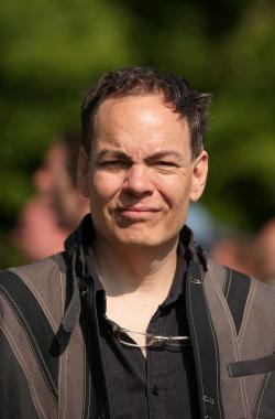 Broadcaster Max Keiser addresses media and protesters in the protester encampment.