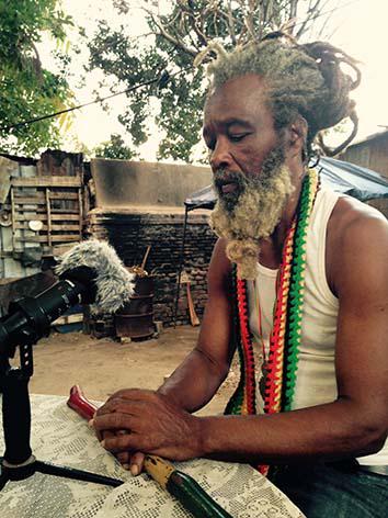 Ras Ayatollah speaks with the writer in the yard at Ibo Spice in