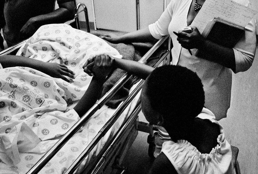 November 2002 , Johannesburg General Hospital, Gauteng A girl supports her friend, who was allegedly raped with another girl during a school outing.