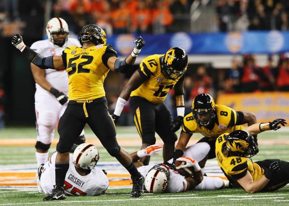 The Missouri Tigers' Michael Sam, No. 52, reacts after a play against the Oklahoma State Cowboys in the 2014 Cotton Bowl.