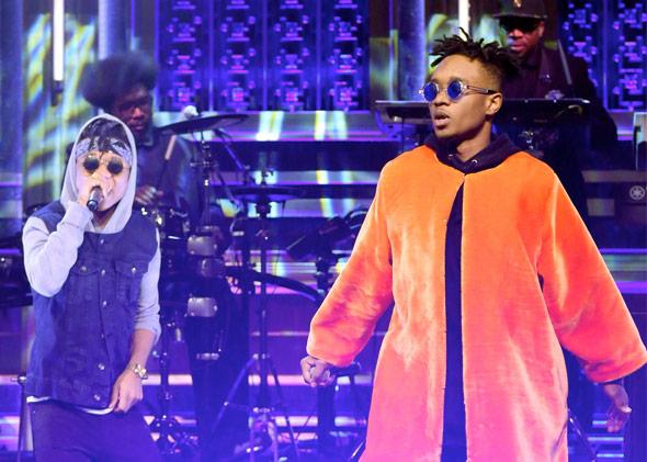 THE TONIGHT SHOW STARRING JIMMY FALLON -- Episode 0174 -- Pictured: (l-r) Swae Lee and Slim Jimmy of musical guest Rae Sremmurd perform with The Roots on December 2, 2014