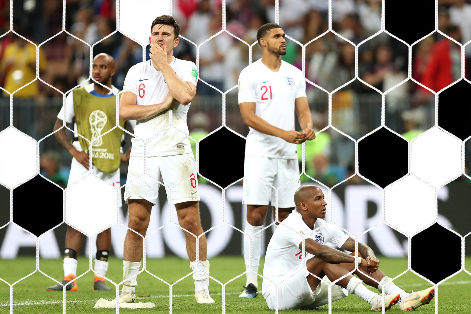 Ashley Young and Harry Maguire of England show their dejection.