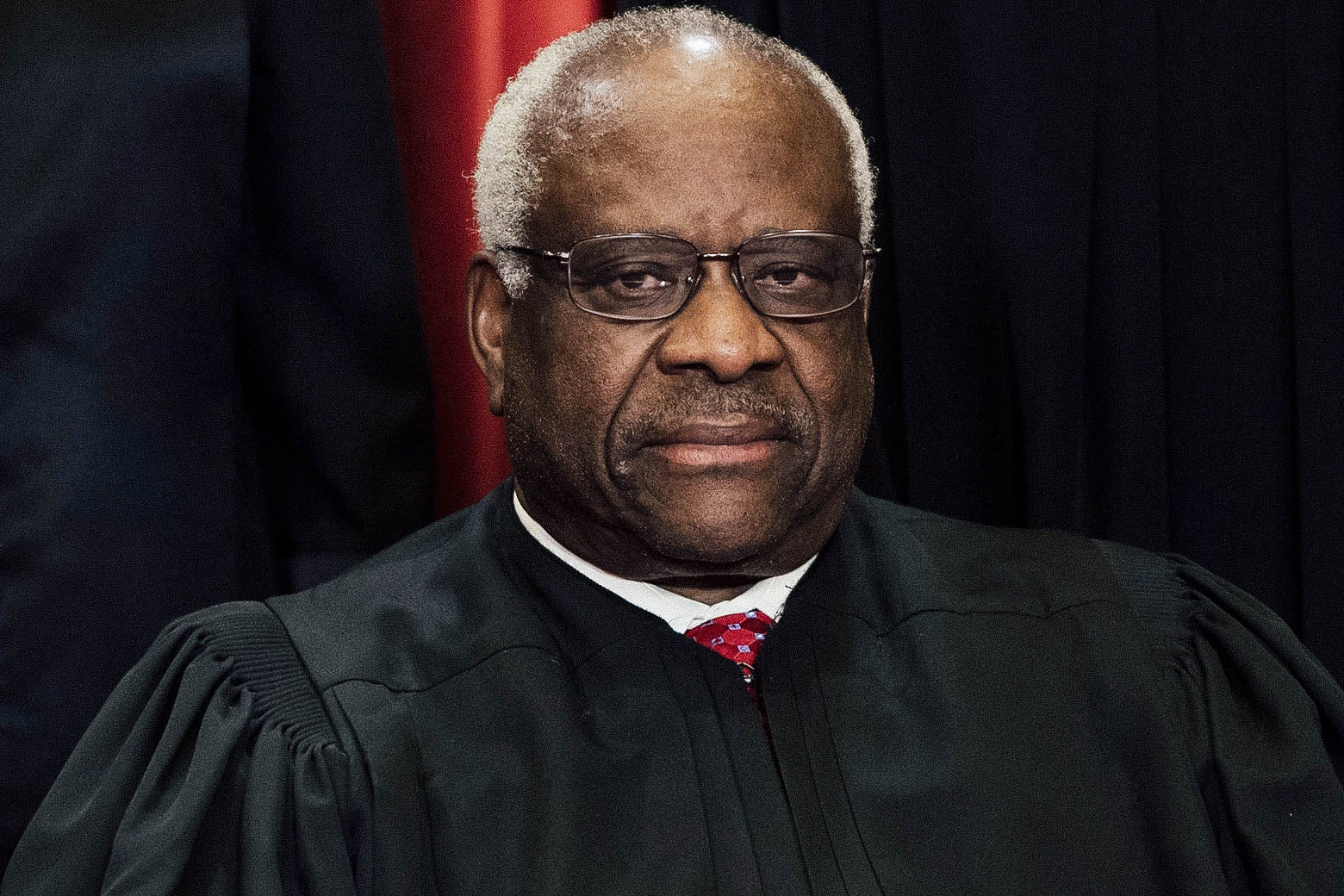 Justice Clarence Thomas seated, in his robes.