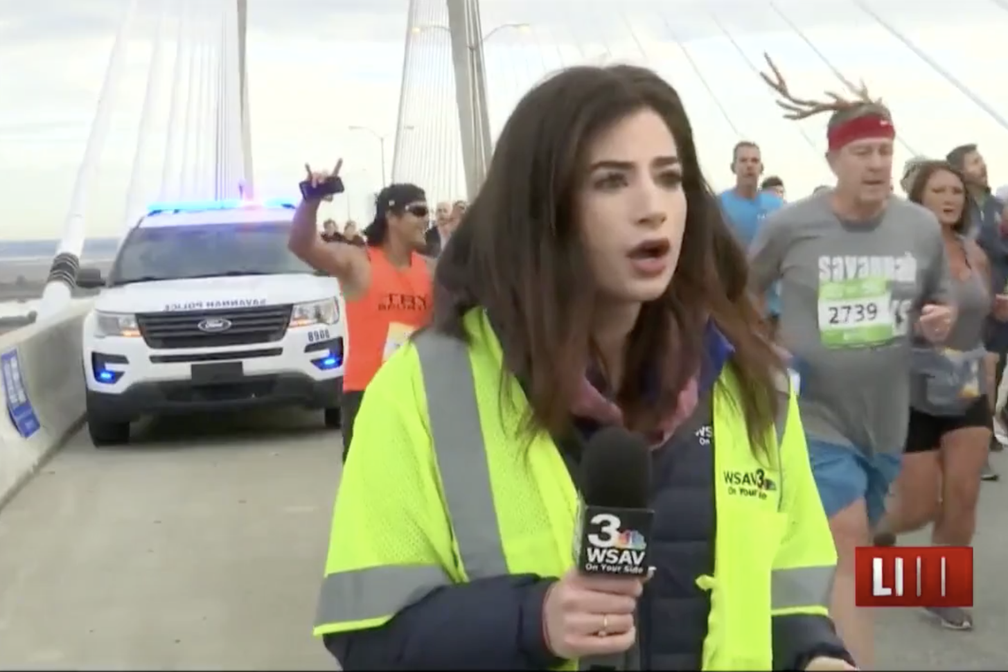 Alex Bozarjian reacts after a man slaps her butt during a live television broadcast of the Enmarket Savannah Bridge Run on Dec. 7, 2019. 