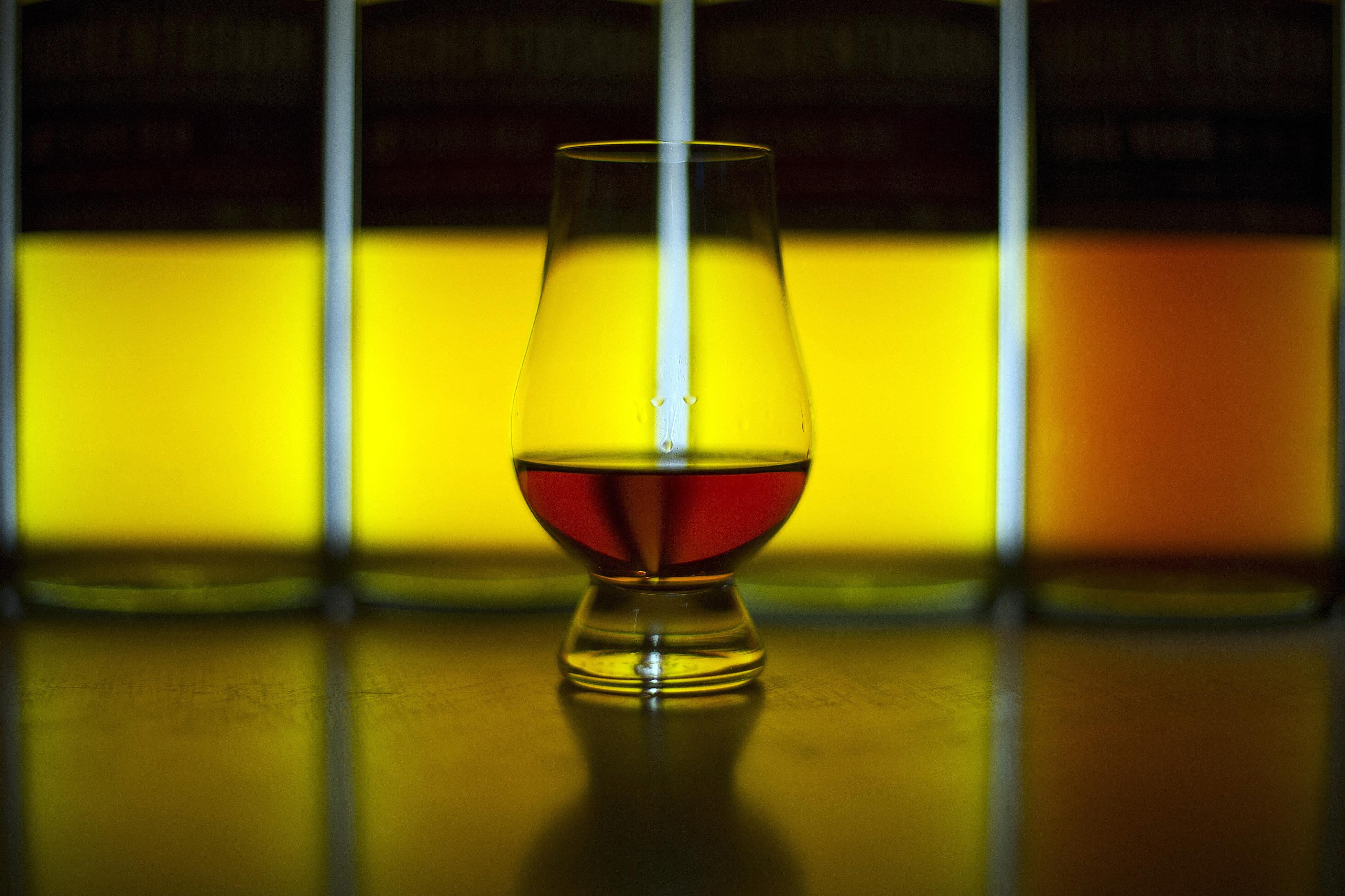 A picture shows a glass of Single Malt whisky produced at the Auchentoshan Distillery, a Single Malt whisky distillery, on the outskirts of Glasgow on December 12, 2016.