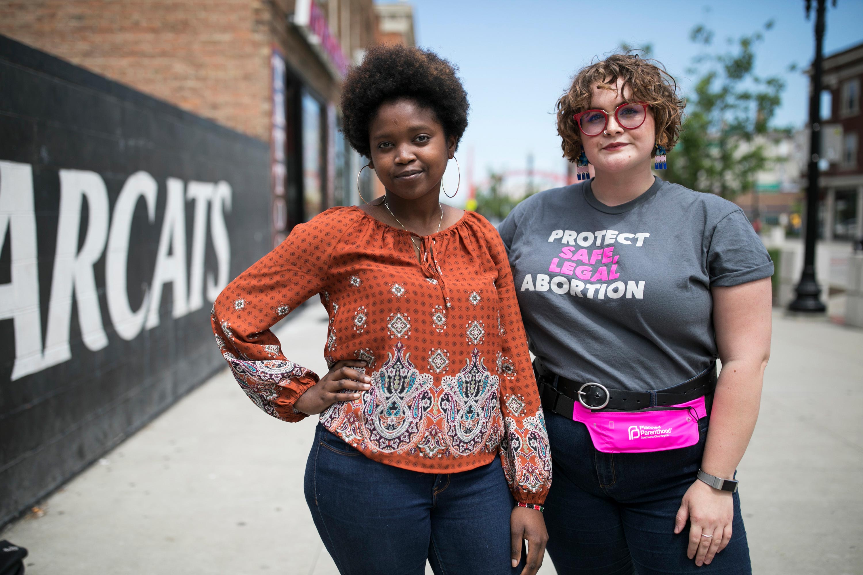 Elizabeth Thuranira and Caroline Lembright pose for a portrait in Cincinnati on May 11.