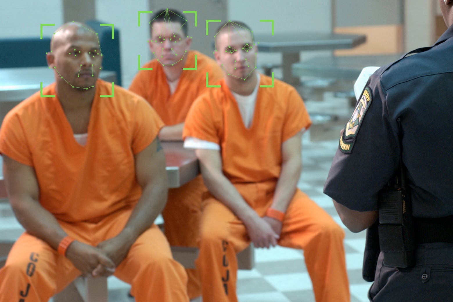 Inmates with facial recognition technology lines on their faces.