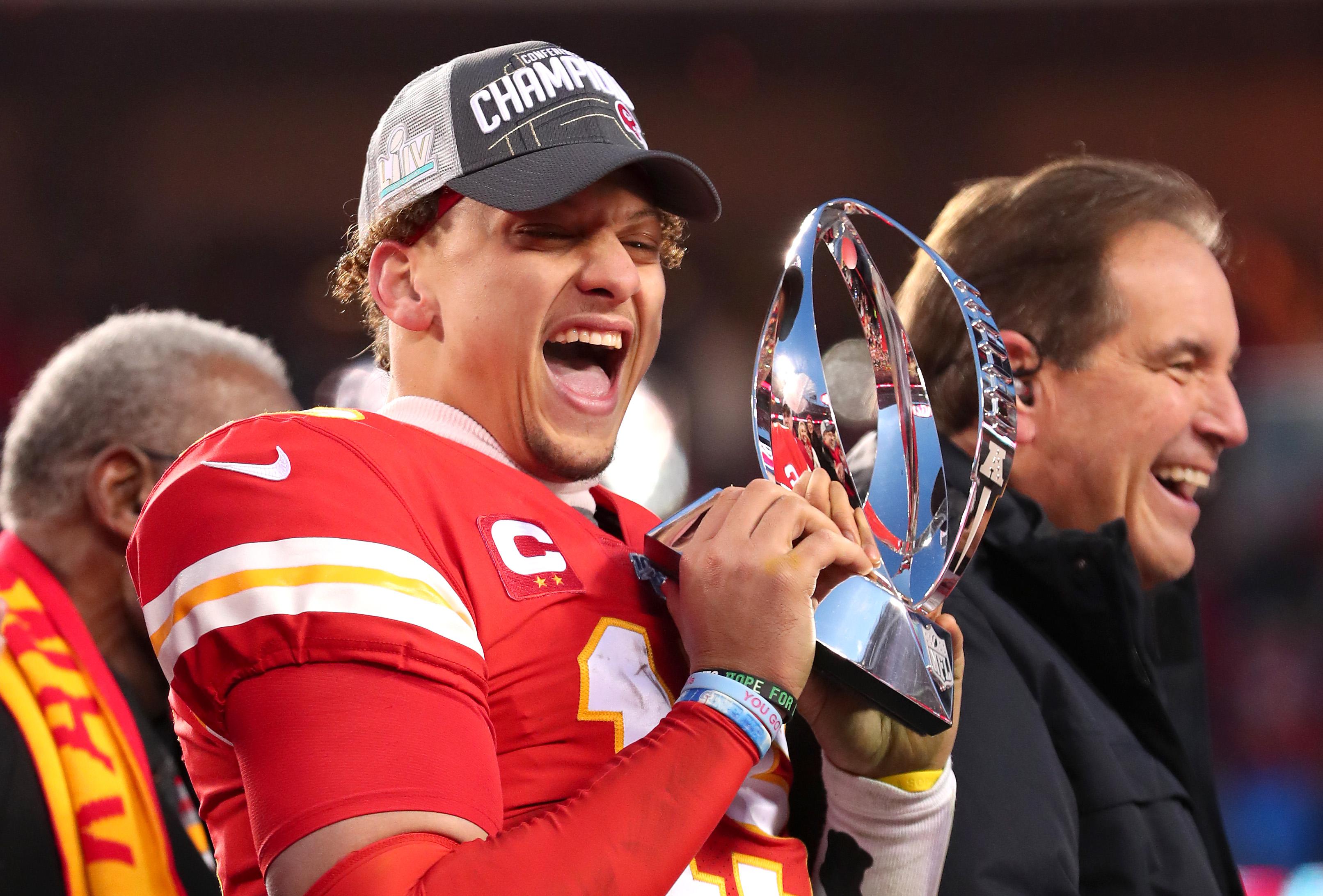 mahomes holding trophy