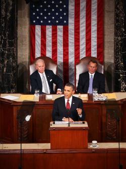 U.S. President Barack Obama, flanked by Vice President Joe Biden (L) and Speaker of the House John Boehner (R-OH) delivers his State of the Union address.