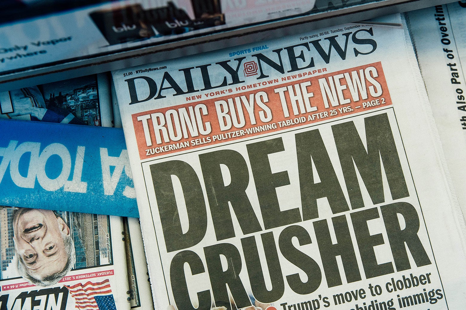 A newsstand copy of the New York Daily News announces the paper's sale to Tronc: "TRONC BUYS THE NEWS."