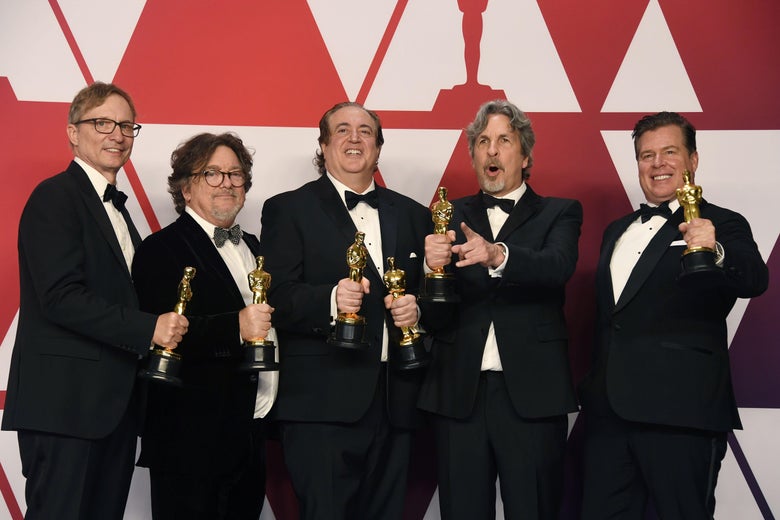 Peter Farrelly, holding out his little golden man, and all the other Best Picture winners for Green Book.