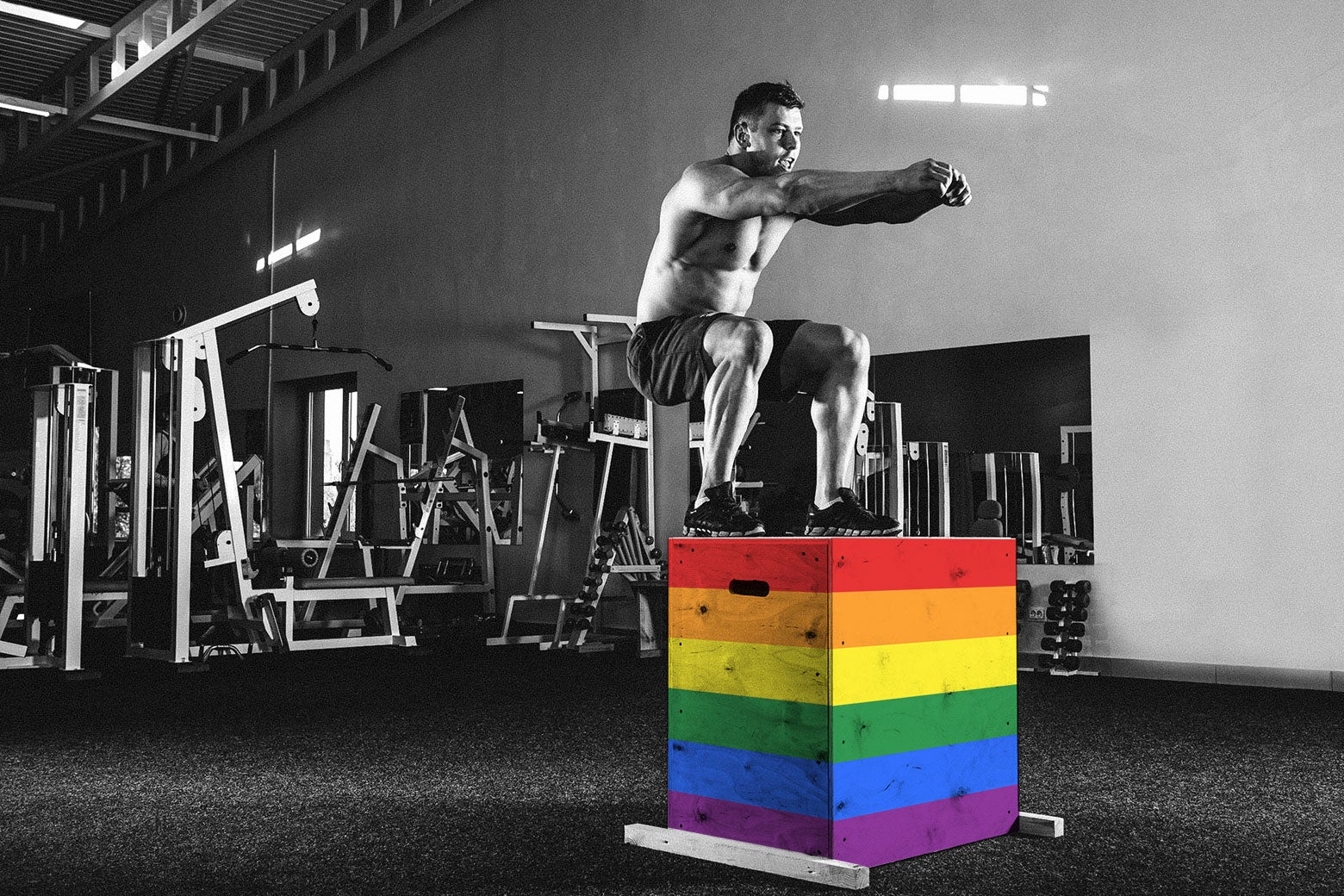 Photo illustration: A man does a box jump at the gym. The boxes have been edited to reflect a rainbow flag.