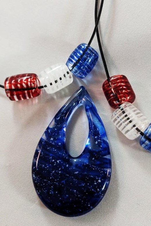 The glass pendant Jon wore during the opening ceremonies.
