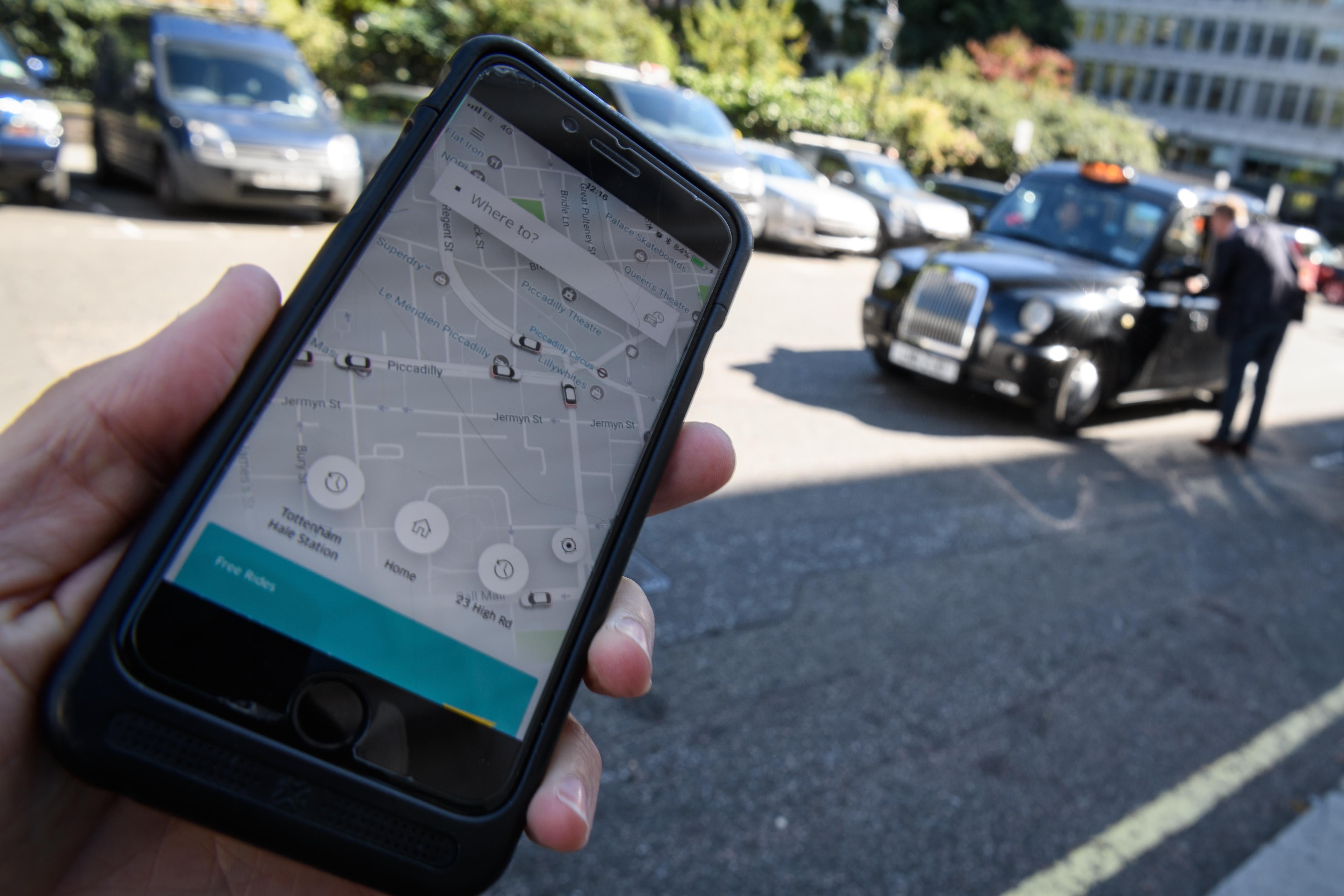 LONDON, ENGLAND - SEPTEMBER 22:  In this Photo Illustration, a phone displays the Uber ride-hailing app on September 22, 2017 in London, England. The Transport Regulator has announced that it will not re-new the company's licence to operate in London as it's current service is 'not fit and proper'.  (Photo by Leon Neal/Getty Images)