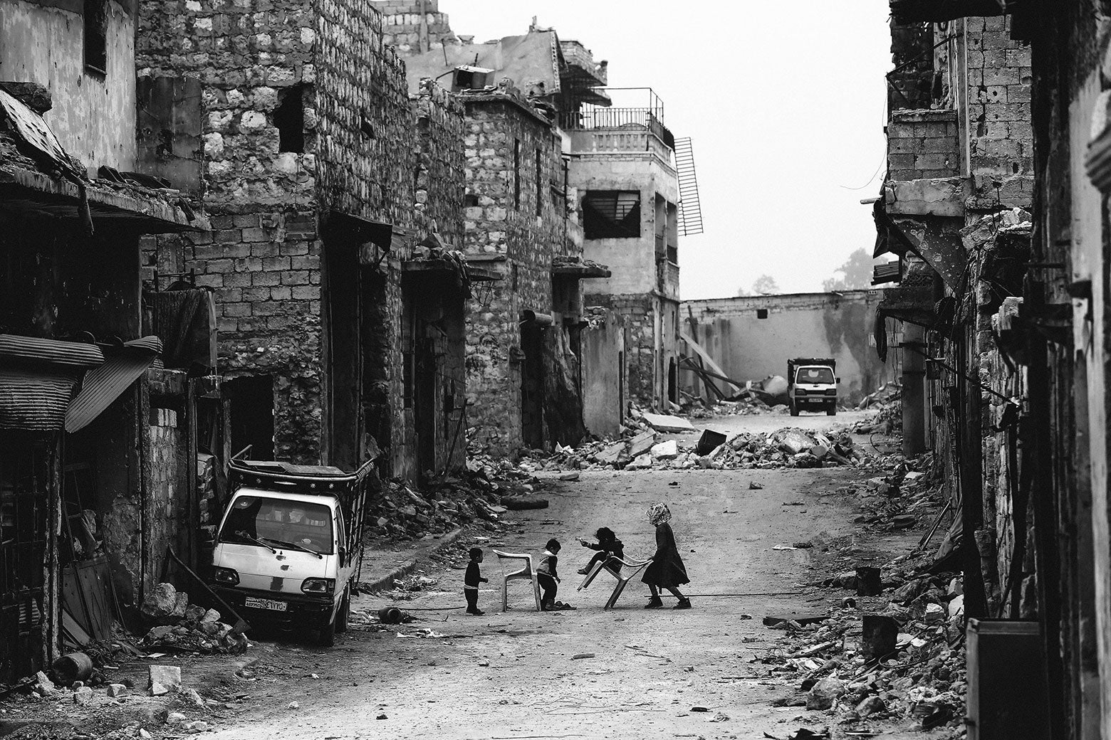 Syrian children play during a sandstorm in the once rebel-held Karm al-Jabal neighbourhood in the northern city of Aleppo on March 10, 2017.