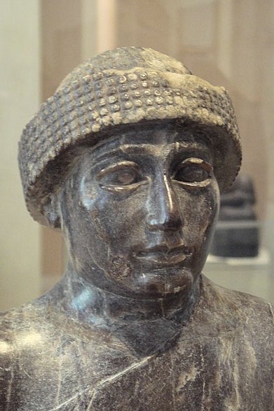 A statue's head, with heavy brows.