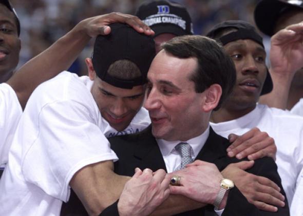 Head coach Mike Krzyzewski hugs his player Shane Battier #31 after defeating Arizona 82-72.