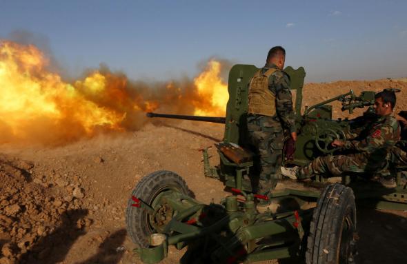 Iraqi Kurdish Peshmerga fighters fire an anti-tank cannon on the front line near Hasan Sham village, some 45 kilometres east of the city of Mosul, during an operation aimed at retaking areas from the Islamic State group on May 29, 2016. The 'peshmerga-led ground offensive, backed by international coalition warplanes' started before dawn, the Kurdistan Region Security Council (KRSC) said. The fresh push against the jihadist organisation comes a week after Iraqi forces launched an operation against Fallujah, IS's only other major urban hub in Iraq.\
