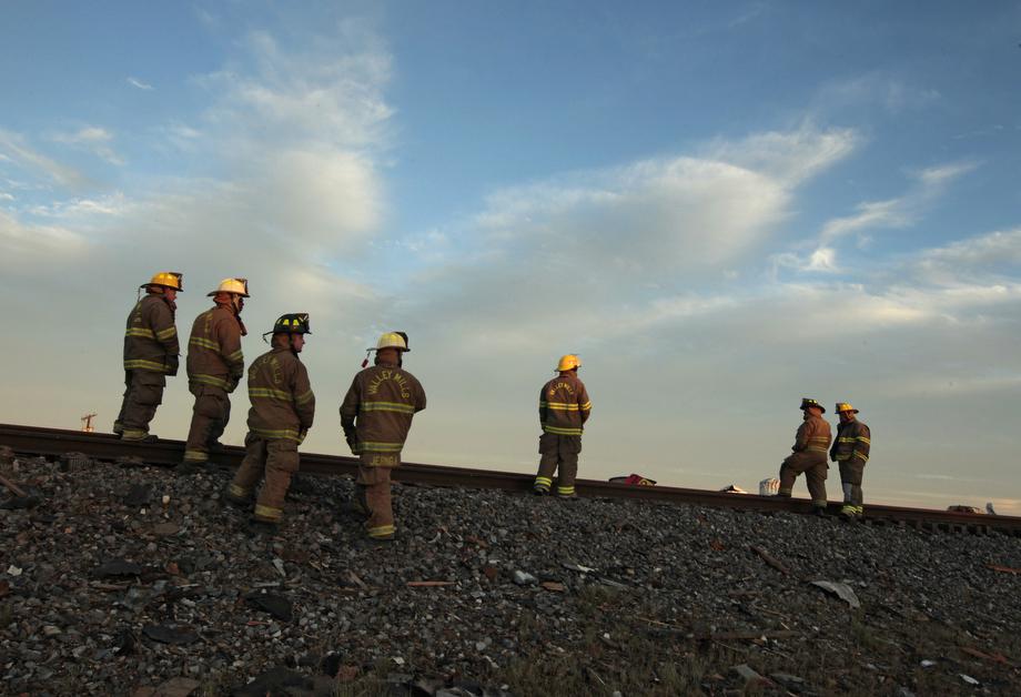 Valley Mills Fire Department personnel view the railroad tracks near to the fertilizer plant that exploded yesterday afternoon on April 18, 2013 in West, Texas.