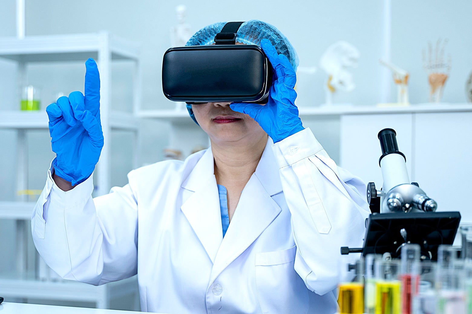 A doctor in a lab coat wearing a VR headset