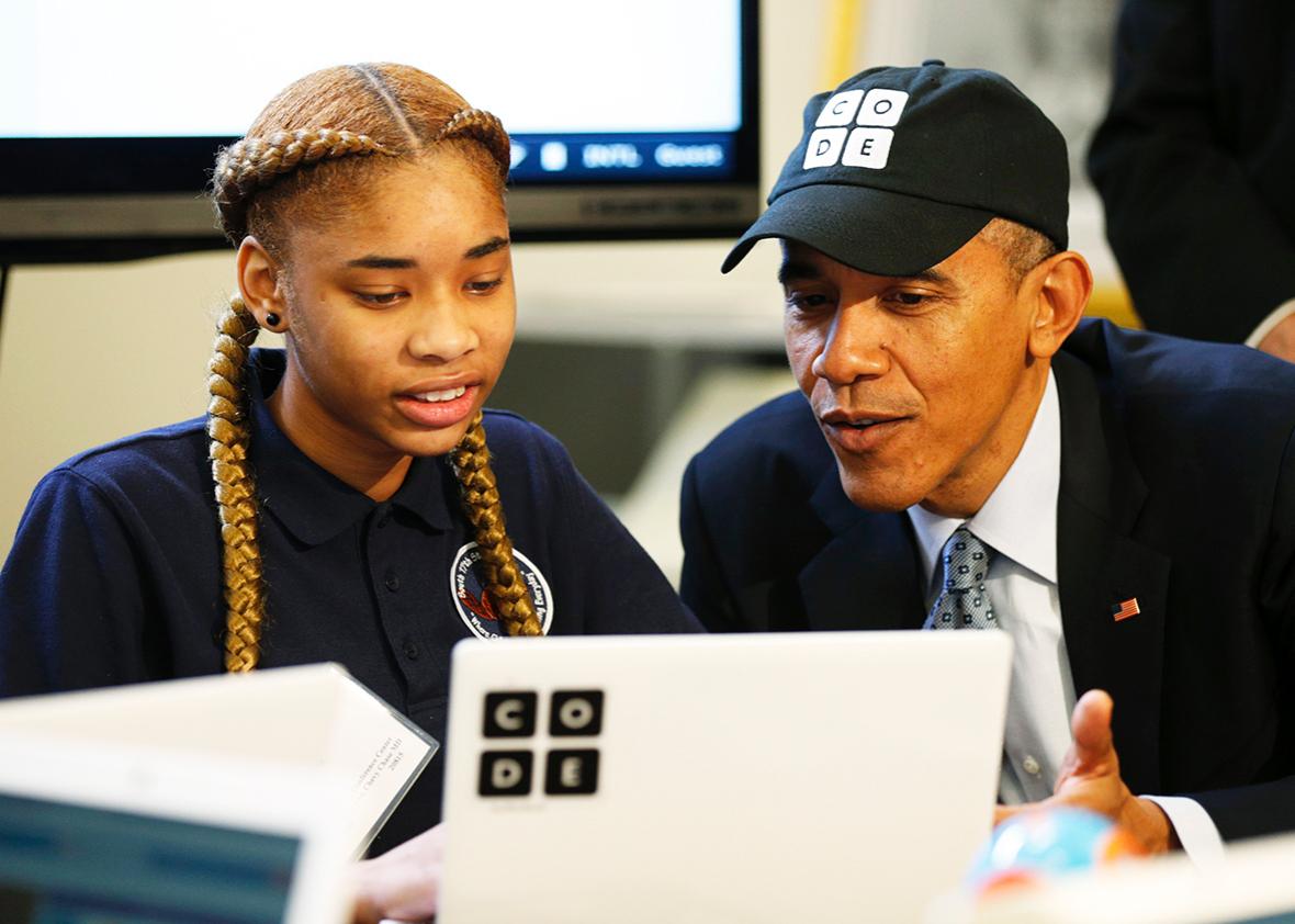 U.S. President Barack Obama talks with Adrianna Mitchell a student from Newark, New Jersey, taking part in an "Hour of Code"? event at the White House in Washington December 8, 2014.