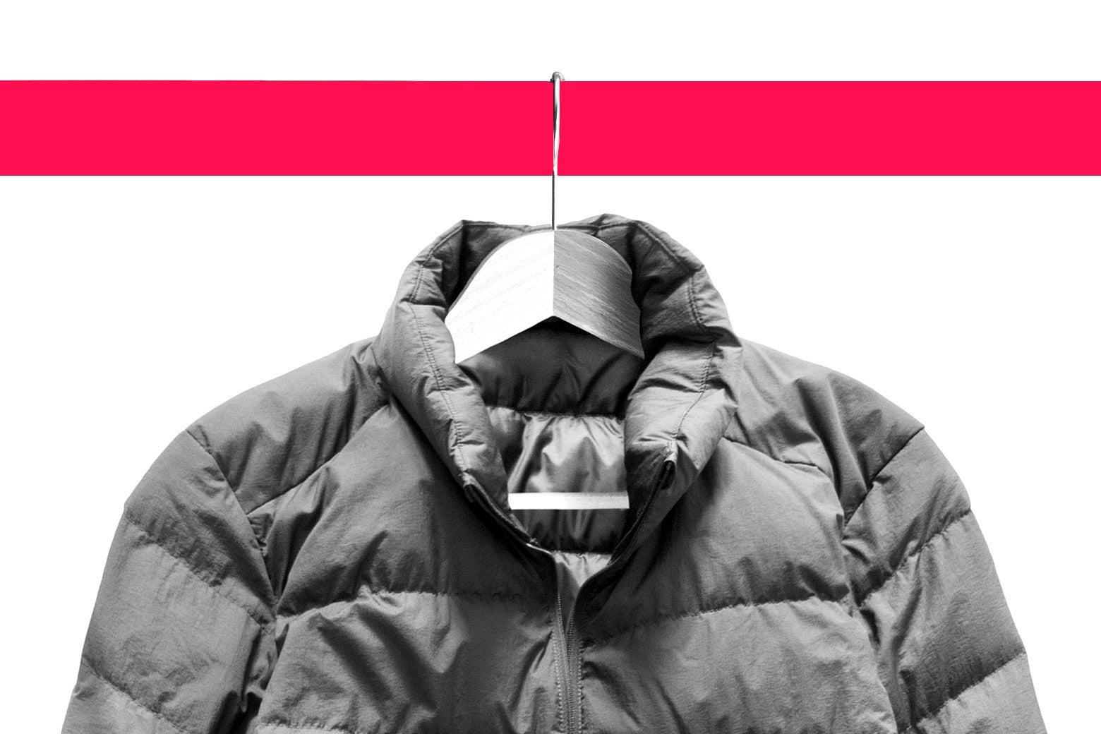 A winter coat on a metal hanger.