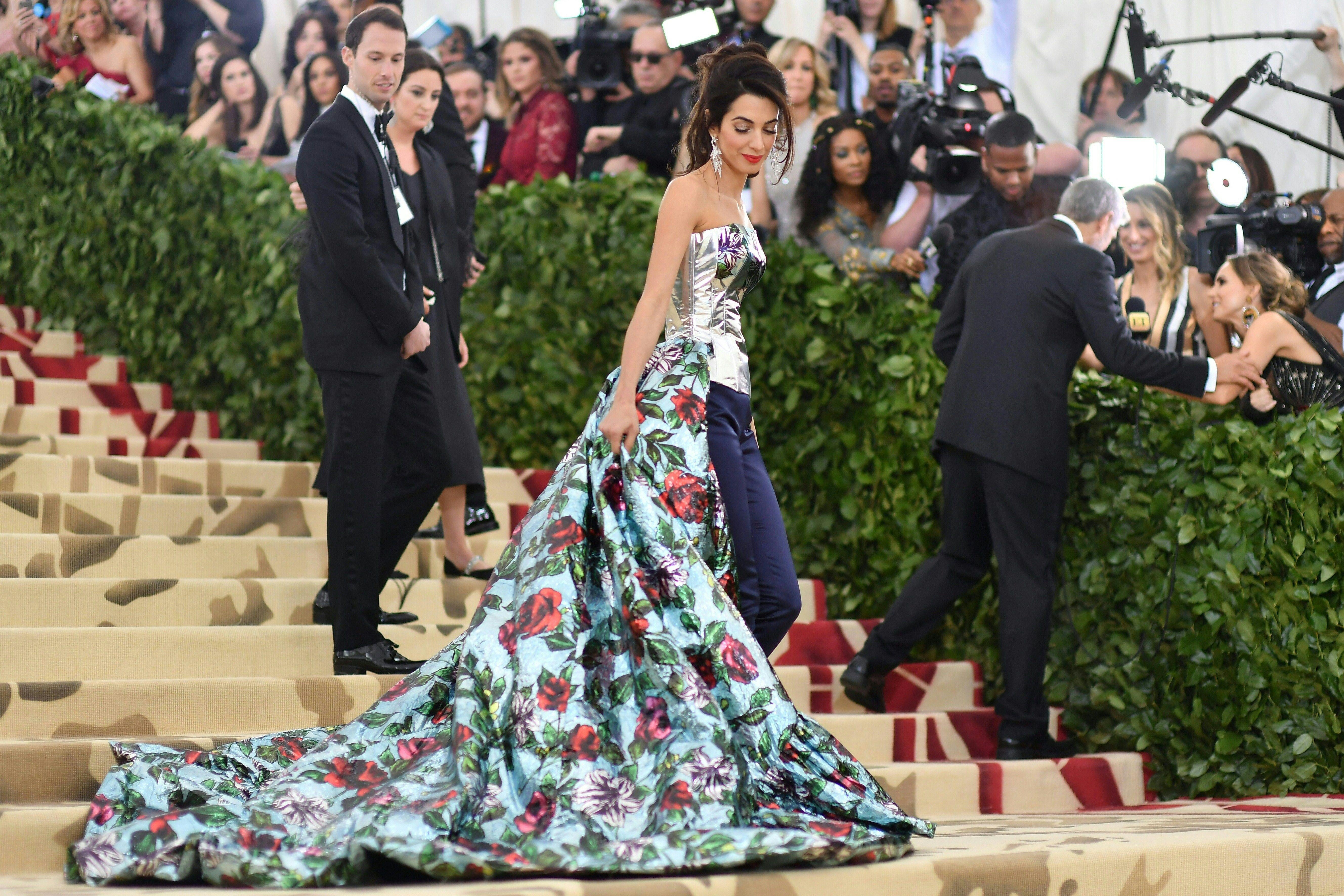 Lawyer Amal Clooney arrives for the 2018 Met Gala on May 7, 2018, at the Metropolitan Museum of Art in New York. - The Gala raises money for the Metropolitan Museum of Arts Costume Institute. The Gala's 2018 theme is Heavenly Bodies: Fashion and the Catholic Imagination. (Photo by Angela WEISS / AFP) (Photo credit should read ANGELA WEISS/AFP/Getty Images)