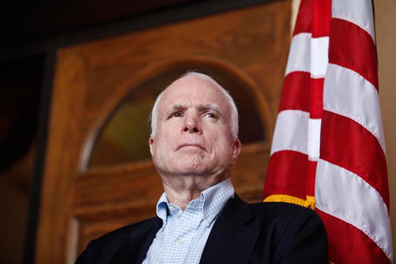 U.S. Senator John McCain (R-AZ) watches his colleagues speak during a news conference following their tour of the Arizona-Mexico border in Nogales, Arizona March 27, 2013.
