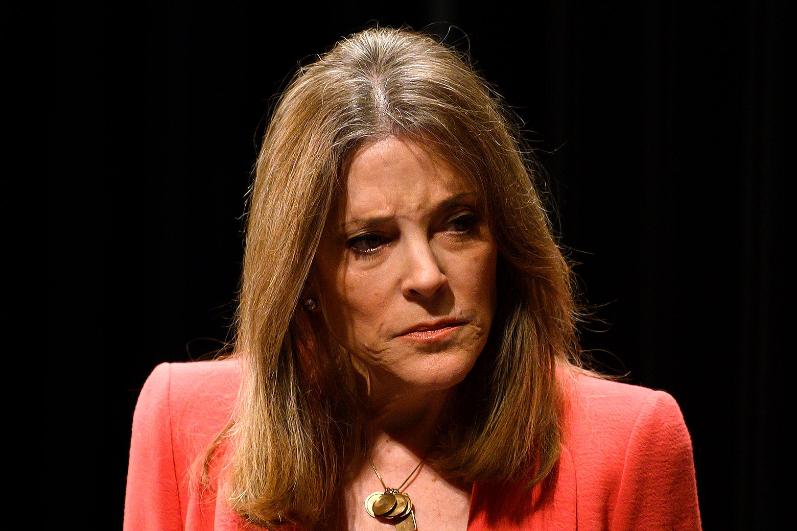 Marianne Williamson is seen looking disgruntled and angry. 