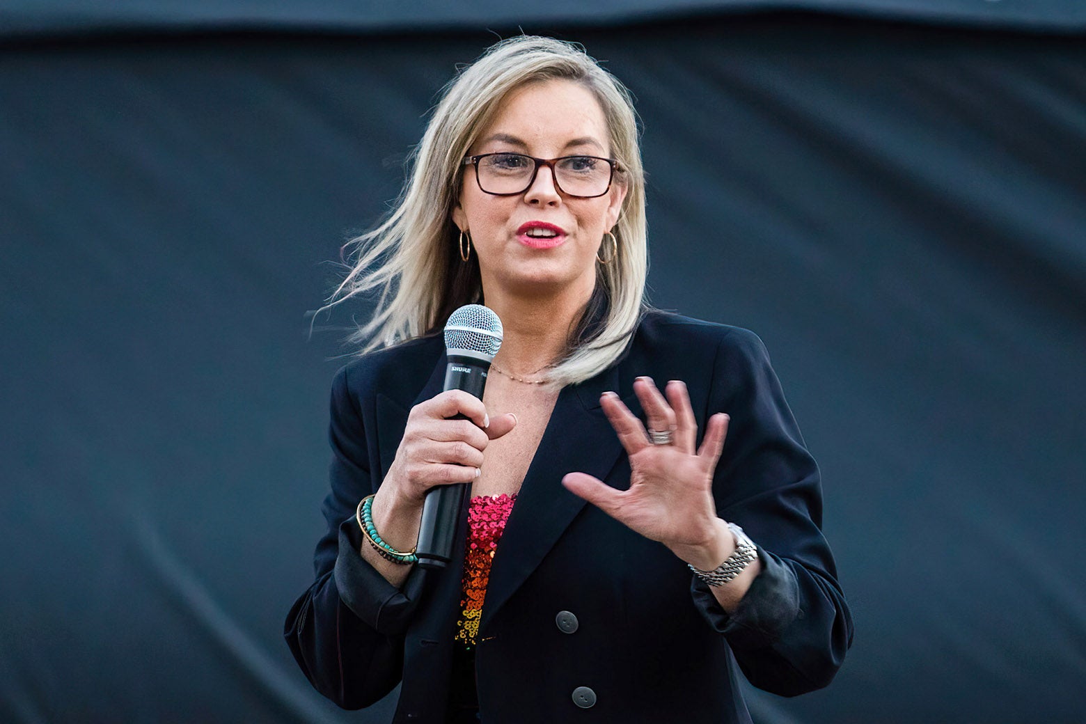 Reno Mayor Hillary Schieve holding a mic in her hand.