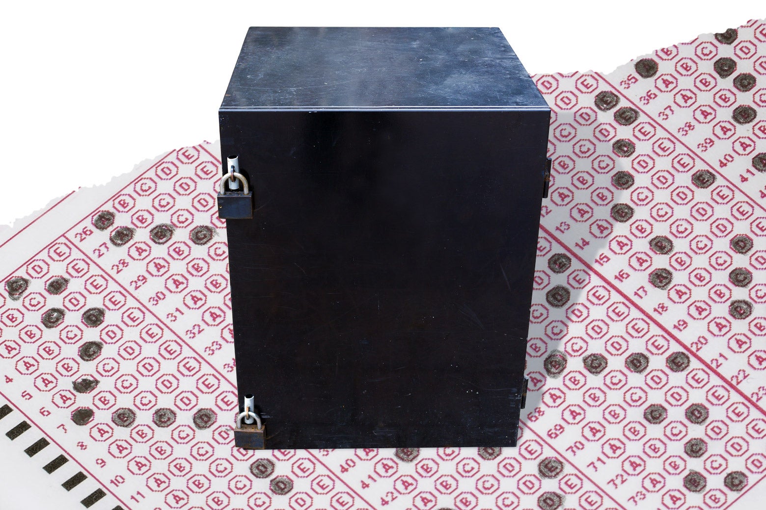 A locked black box sits atop a sheet of standardized test answer bubbles.