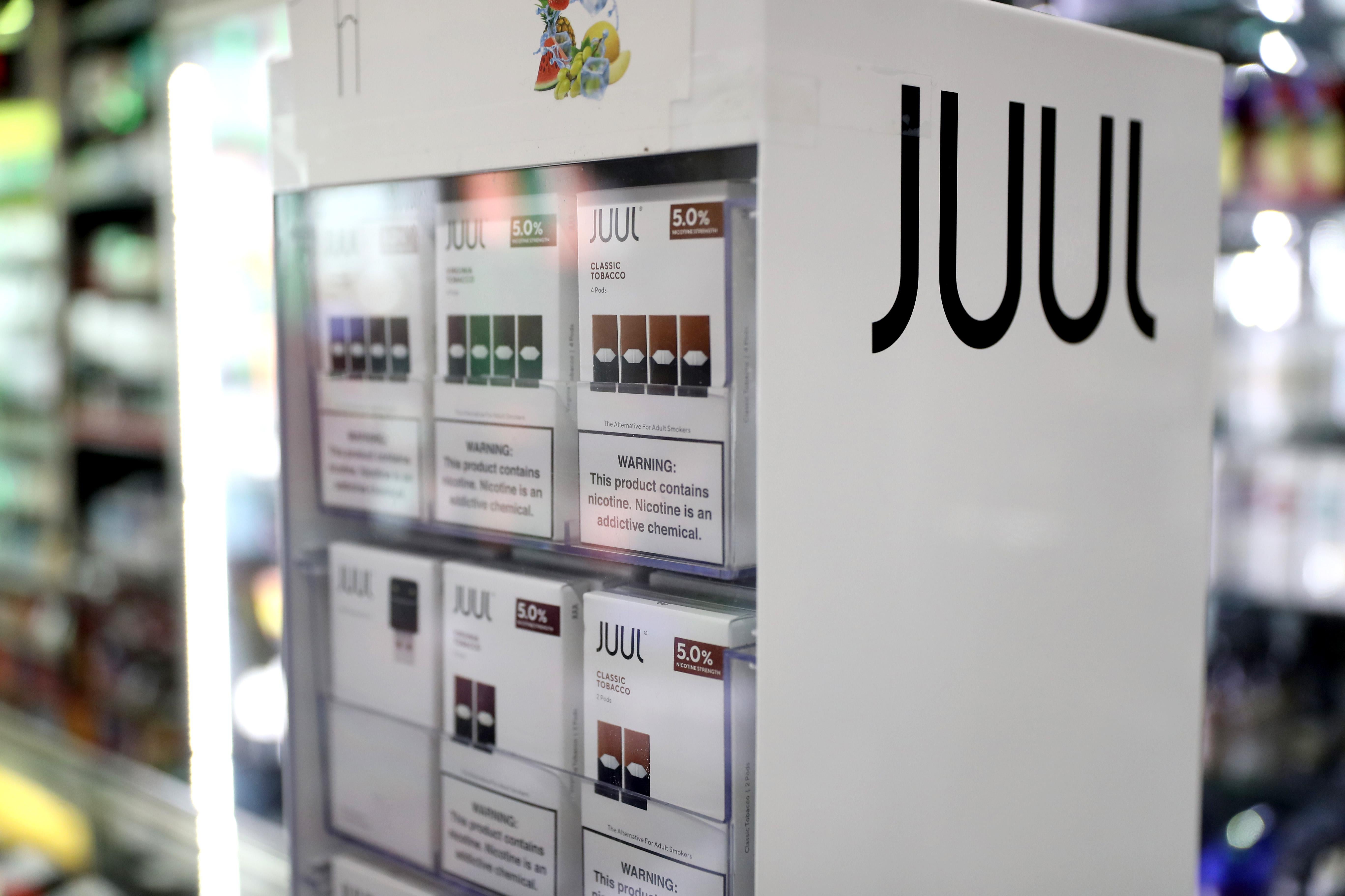 Juul products in a display case.