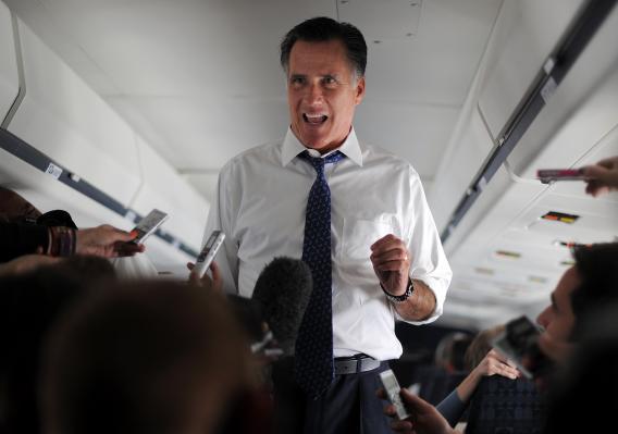 Mitt Romney talking to journalists onboard his campaign plane last week