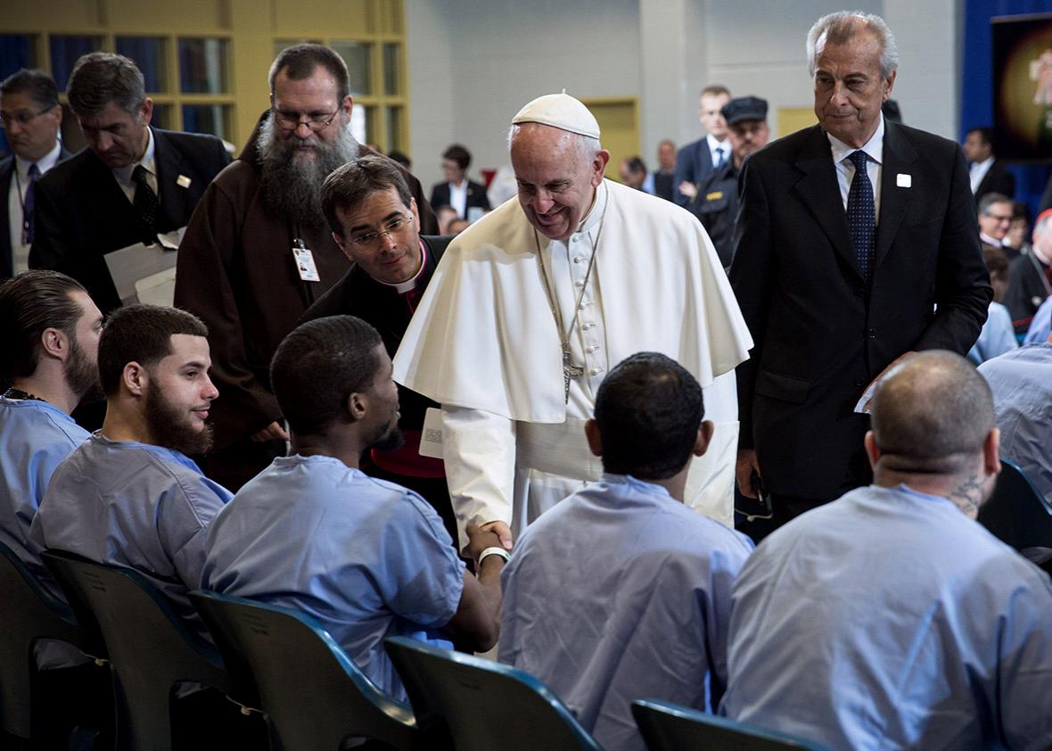Pope Francis visits with inmates.