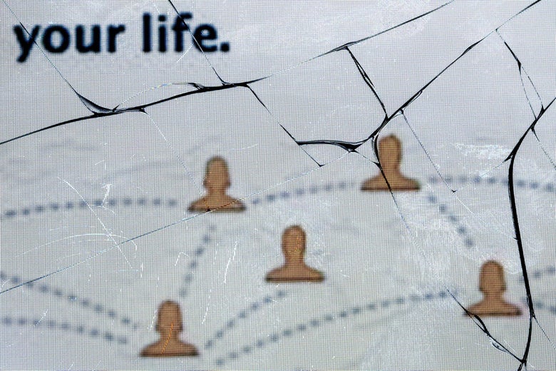 The logo of the social network Facebook on a broken screen of a mobile phone.