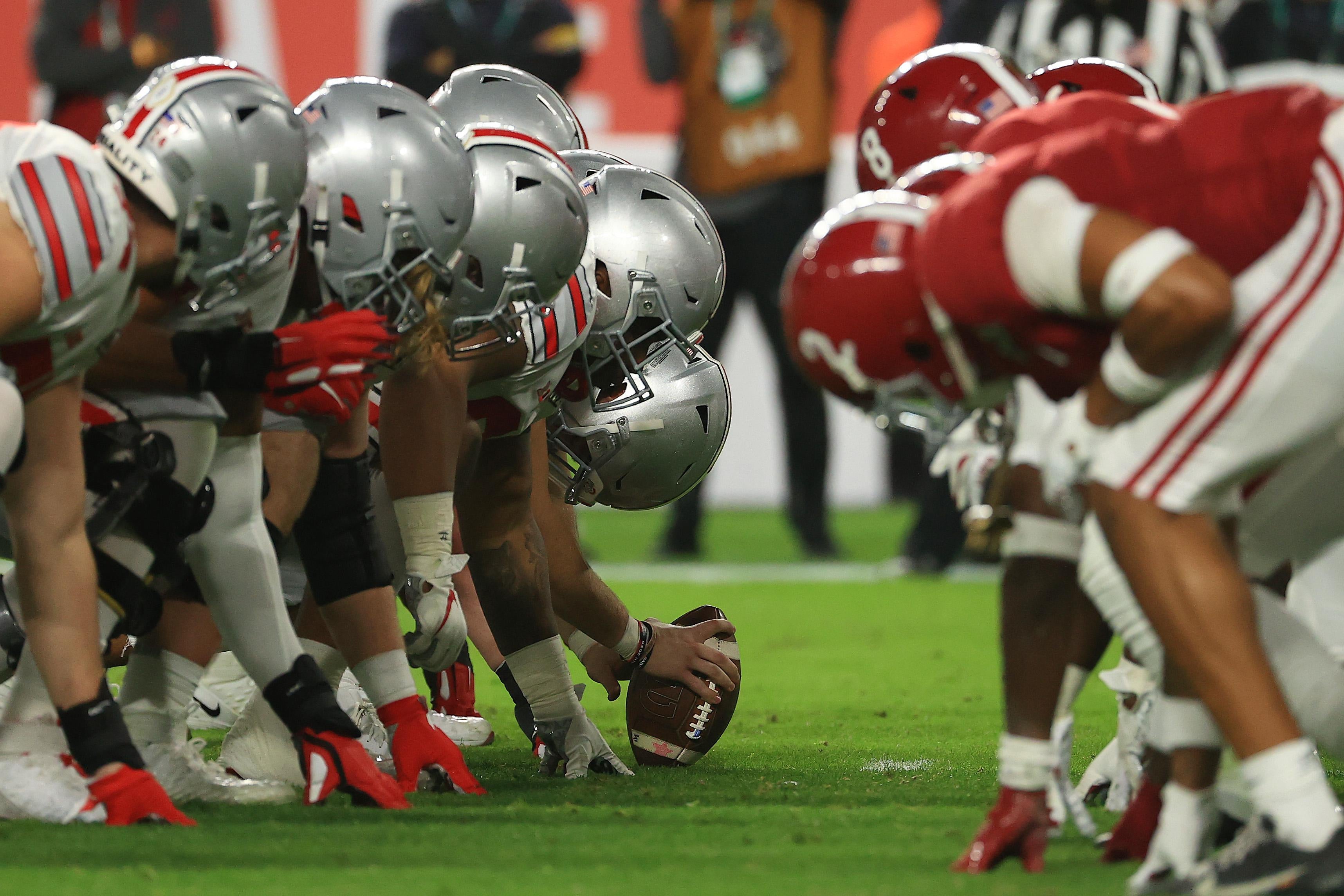 Ohio State's offensive line lined up ready to snap the ball against Alabama's defensive line