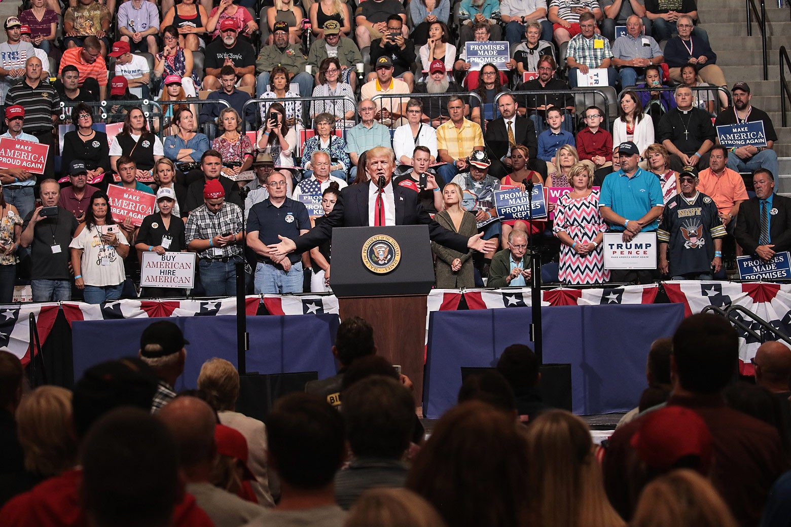 President Donald Trump speaks at a rally on June 21 in Cedar Rapids, Iowa. Trump spoke about renegotiating NAFTA and building a border wall that would produce solar power during the rally.