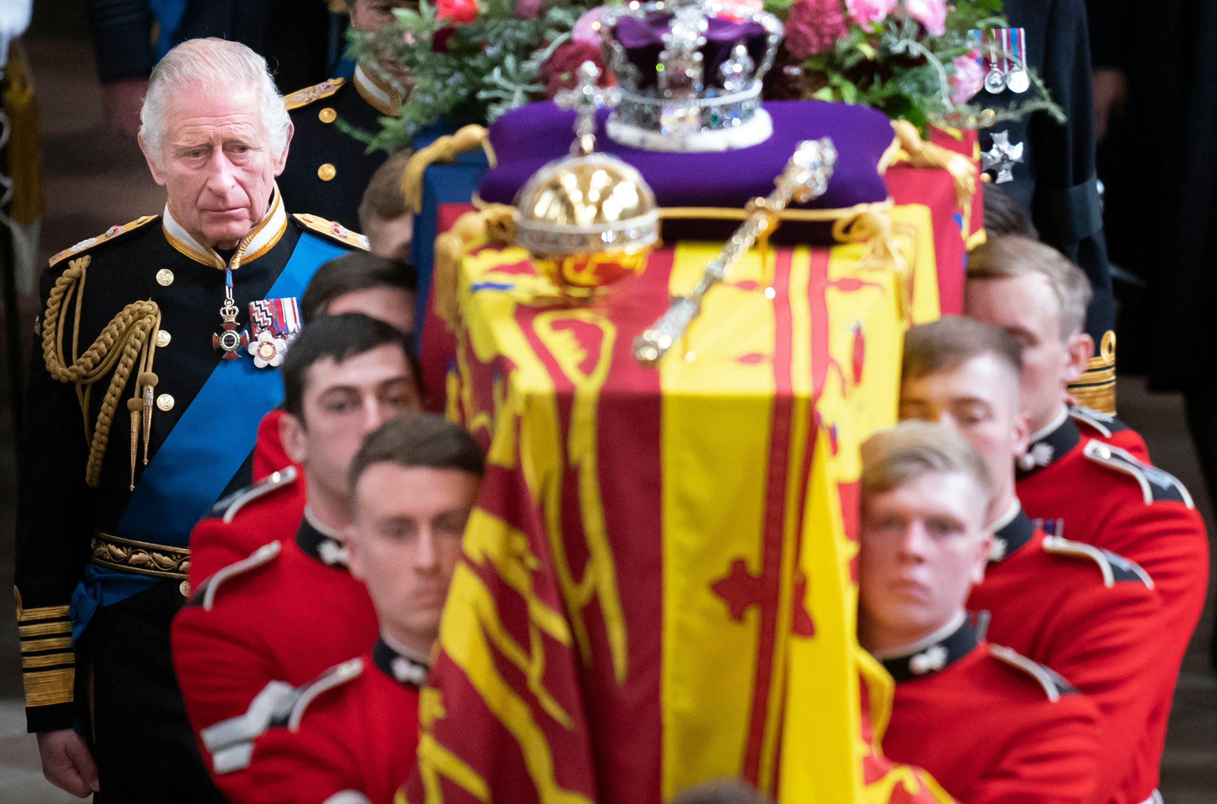King Charles III and members of the royal family follow the coffin of Queen Elizabeth II, draped in the Royal Standard with the Imperial State Crown and the Sovereign's orb and sceptre, as it is carried out of Westminster Abbey after her State Funeral on September 19, 2022. (Photo by Danny Lawson / POOL / AFP) (Photo by DANNY LAWSON/POOL/AFP via Getty Images)