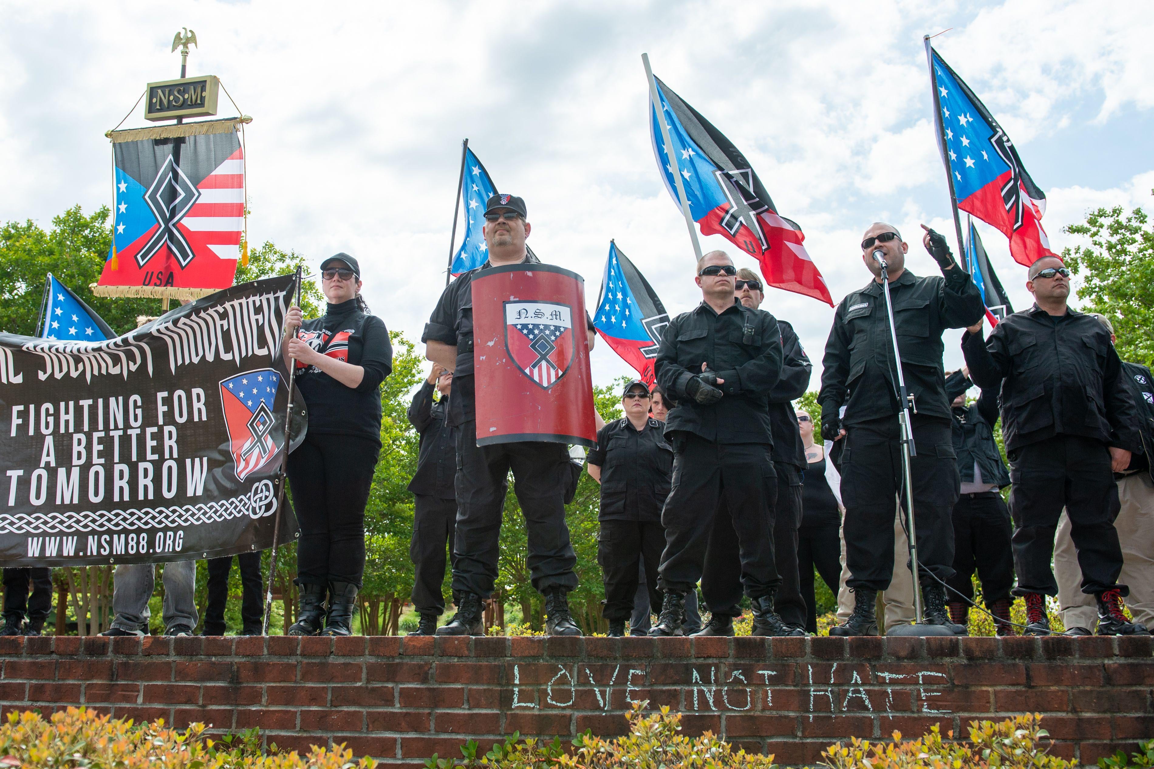 National Socialist Movement leader Jeff Schoep (2nd R) speaks during a white nationalist rally in Newnan, Georgia on April 21, 2018. 