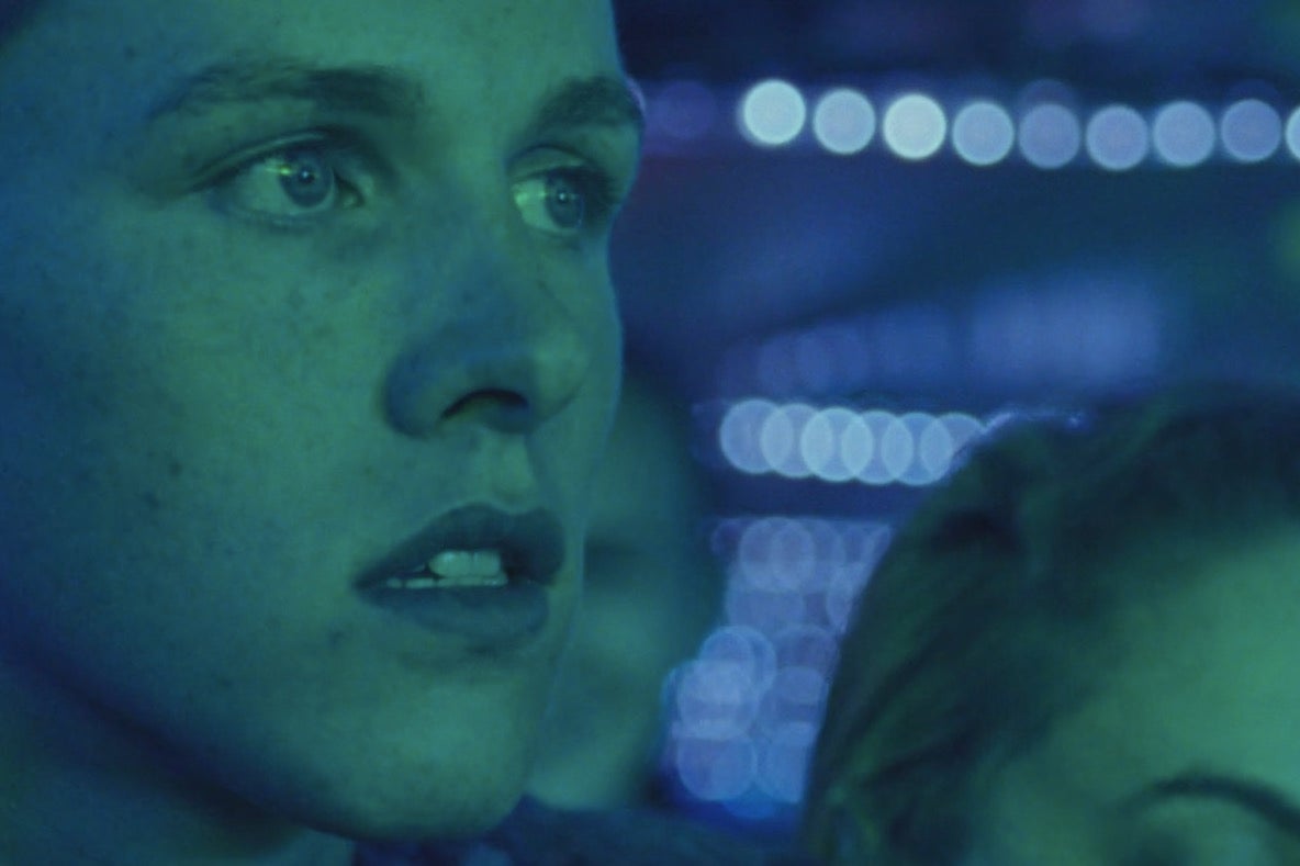 A neon still from Beach Rats.