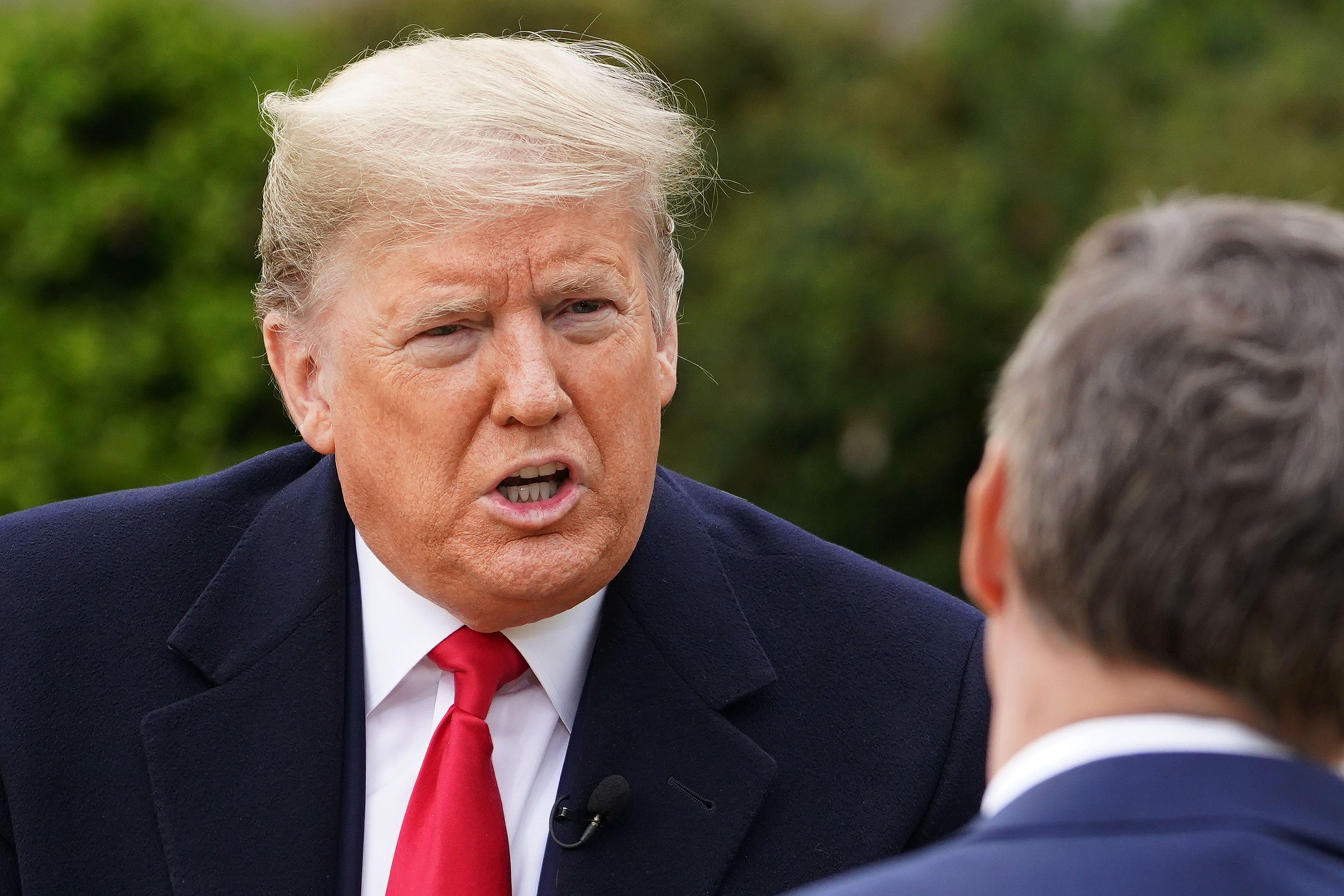 US President Donald Trump speaks with anchor Bill Hemmer during a Fox News virtual town hall meeting from the Rose Garden of the White House in Washington, D.C.