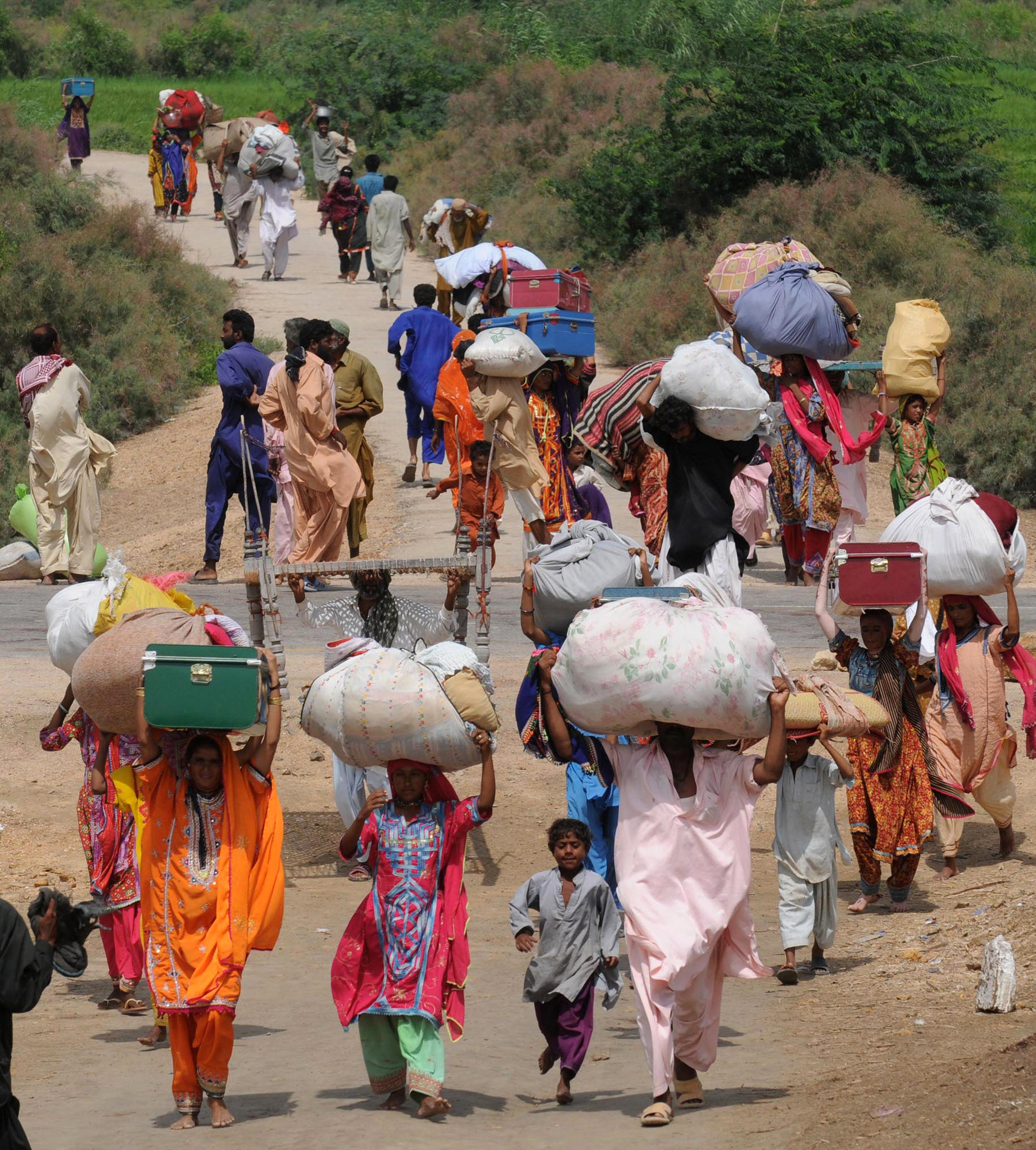 Women carrying parcels on their heads.