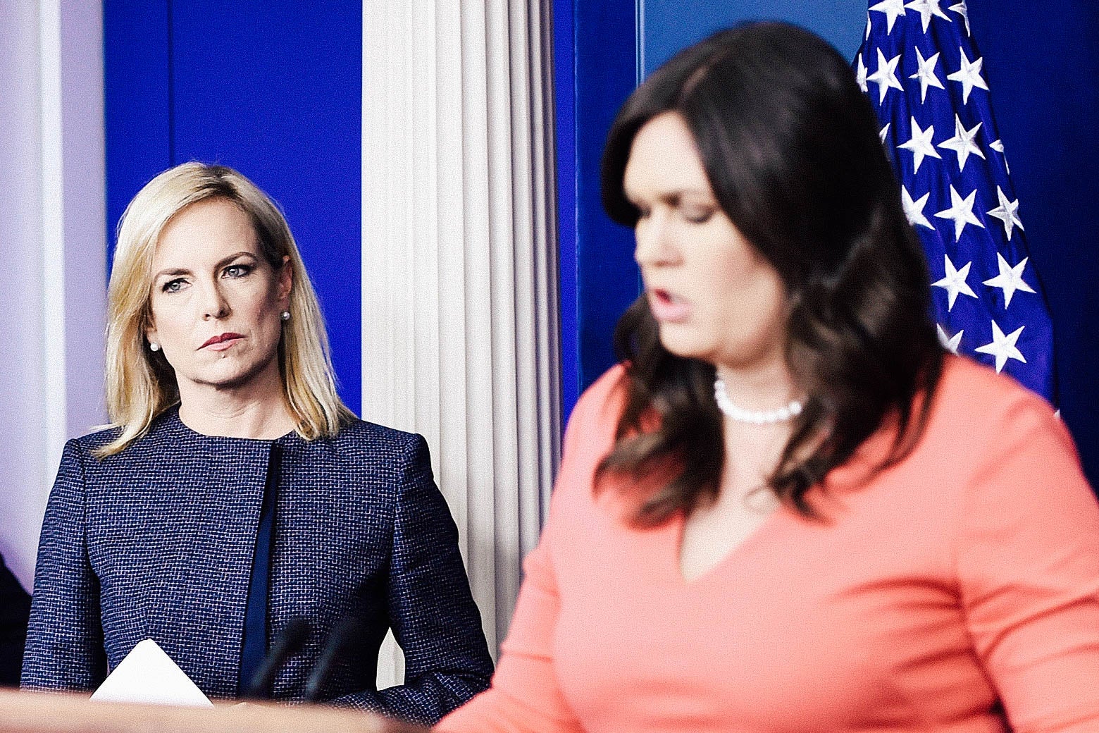 Secretary of Homeland Security Kirstjen Nielsen looks on as White House spokesperson Sarah Huckabee Sanders speaks during a press briefing at the White House.