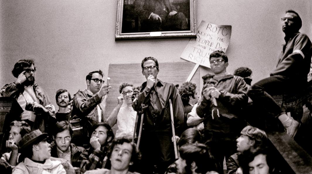 Young professor supports demonstrators outside college president's office, Hanover, New Hampshire, Spring 1969.