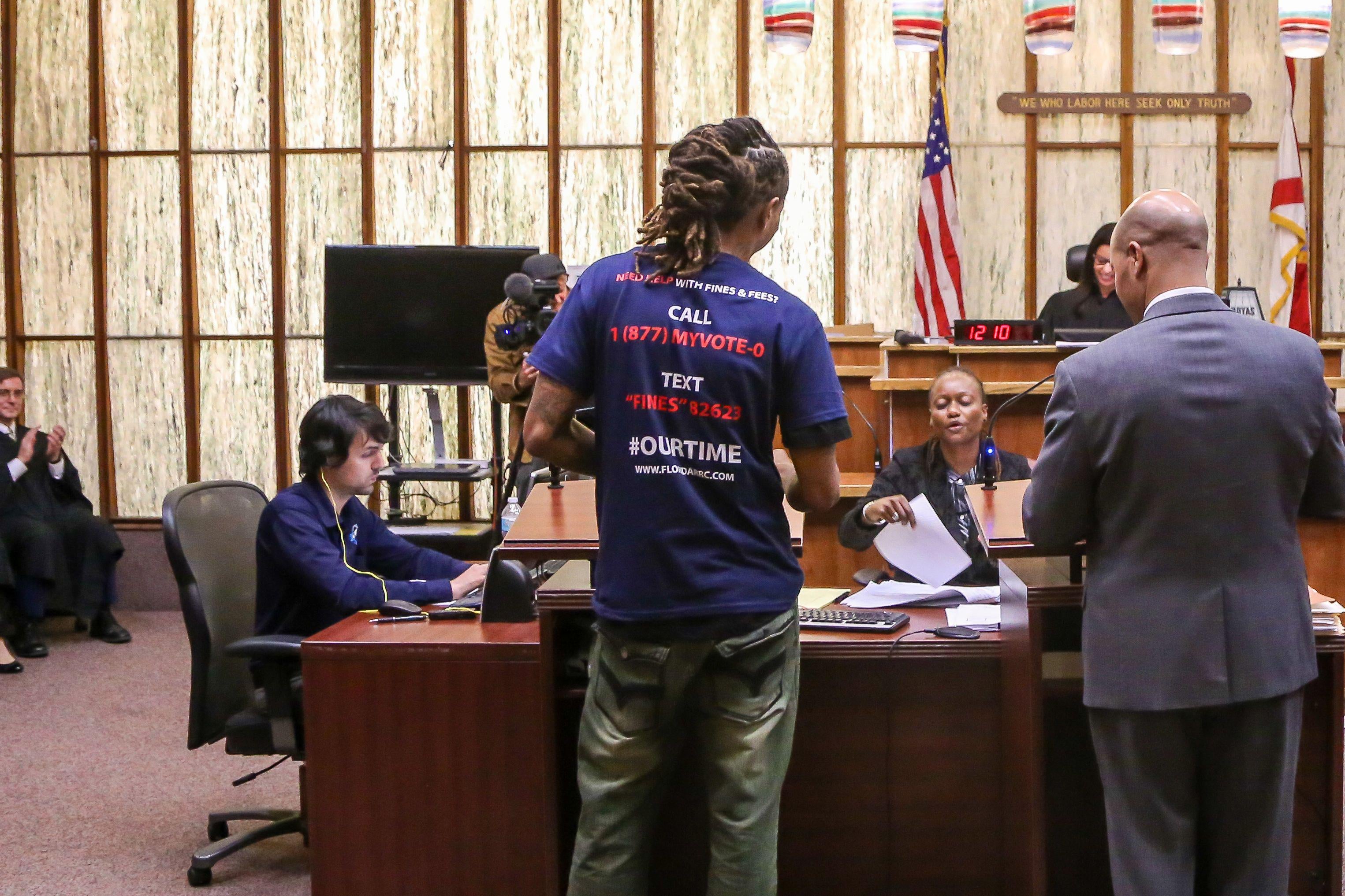 A man who has never been eligible to vote is called up during a special court hearing aimed at restoring the right to vote under Florida's Amendment 4 in a Miami-Dade County courtroom in November.