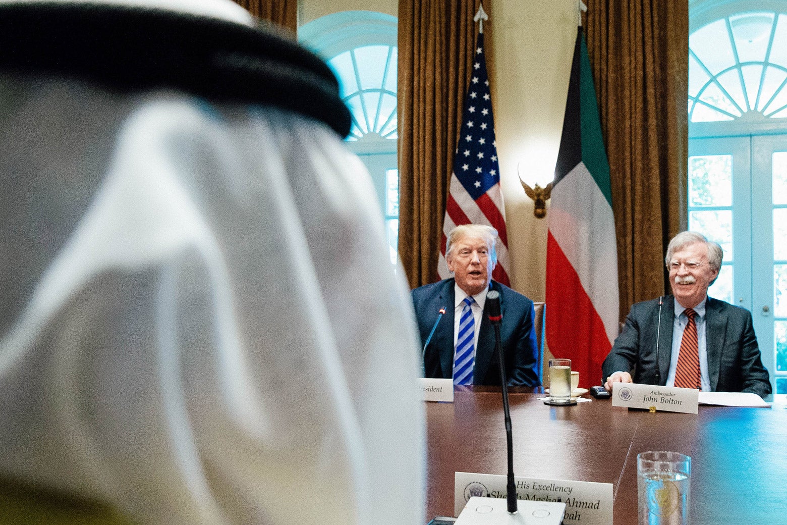 President Donald Trump and National Security Adviser John Bolton sit across the table from the Emir of Kuwait Jaber Al-Ahmad Al-Sabah.
