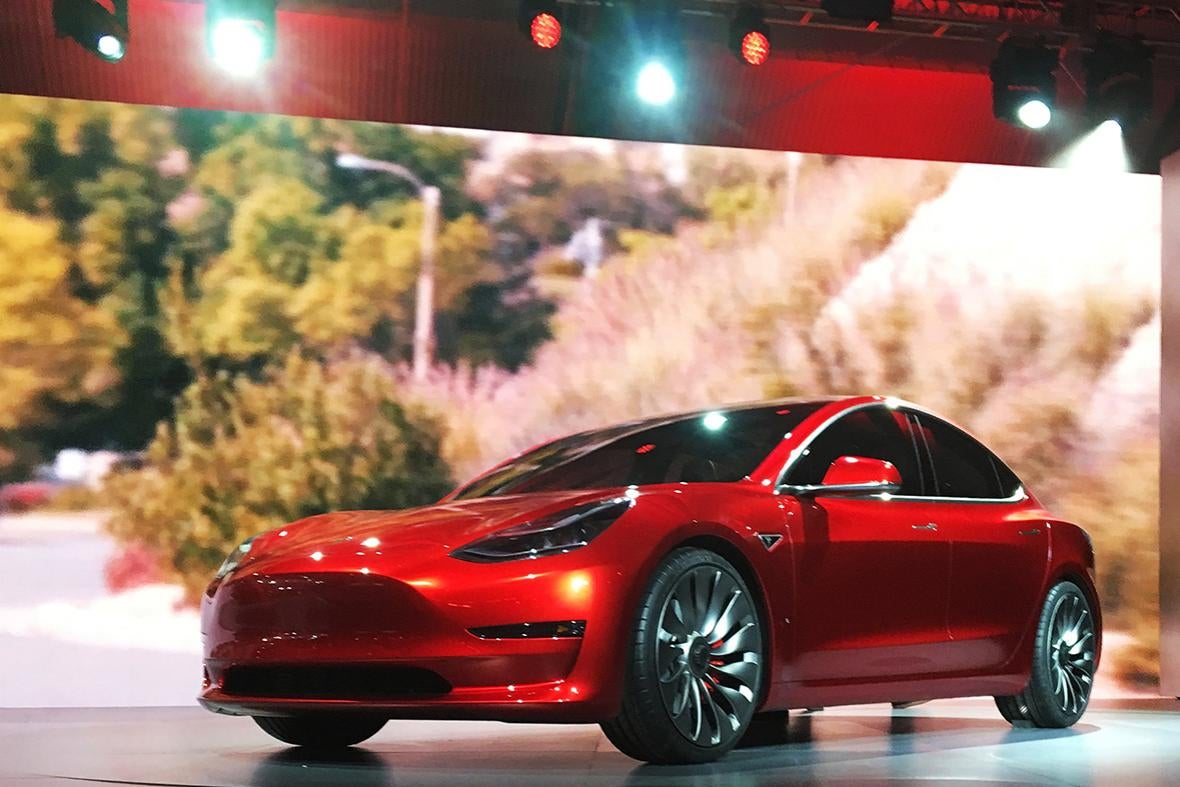A Tesla Model 3 sedan, its first car aimed at the mass market, is displayed during its launch in Hawthorne, California, March 31, 2016.