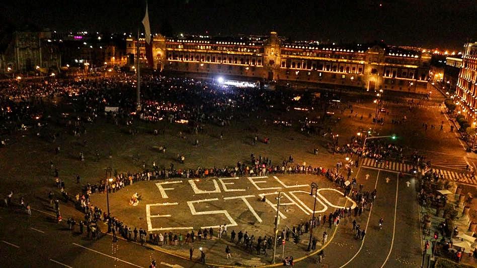 “Fue el estado” (It was the state) painted on the Zócalo, or main square, Mexico City, October 2014.