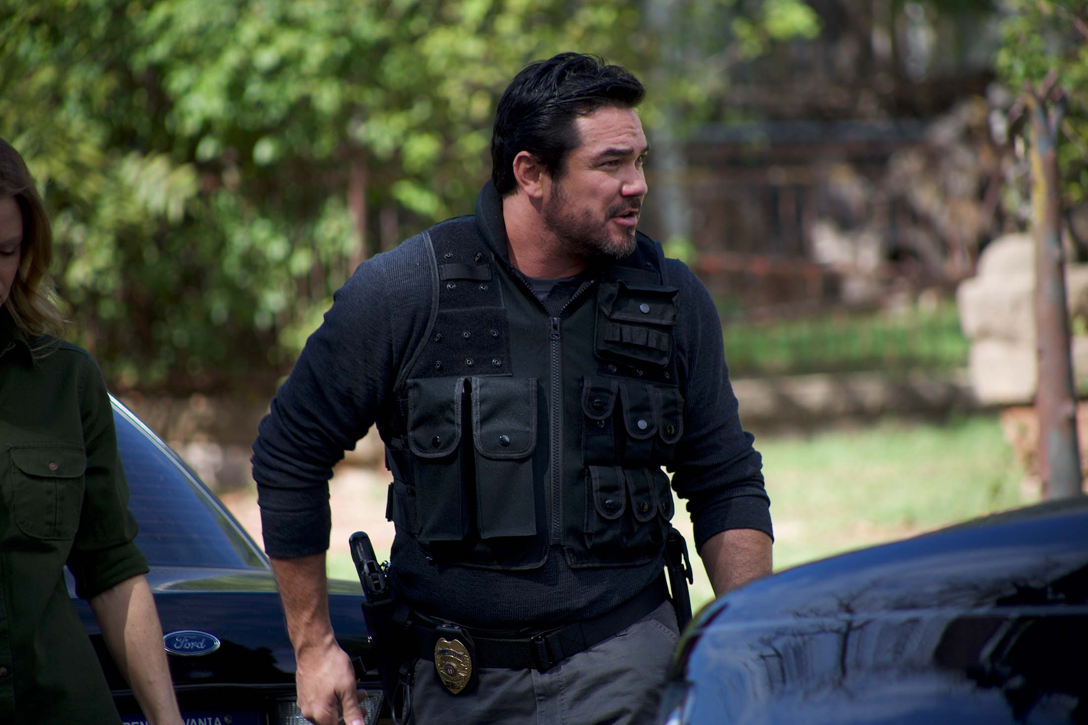 Dean Cain in a tactical police vest in a still from the movie.